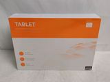 the box of the tablet is sitting on a white surface