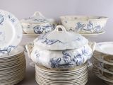 a lot of plates and bowls with blue designs on them