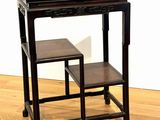 a small table with two stools on it on a hard wood floor