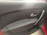 door panel of a car with a red door handle and a black door handle
