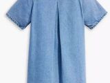 a baby girl ' s denim dress with ruffles on the shoulders