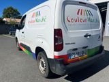 a van that is parked in front of a building