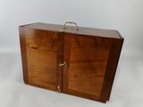an image of a wooden case with two doors open on a white background