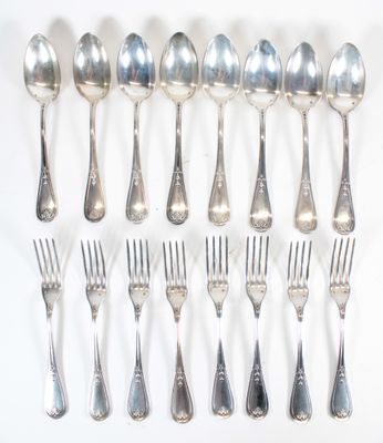 a lot of silver spoons and forks on the table