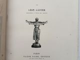 an open book with a drawing of a statue on it