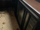 a kitchen with a sink and a counter in it