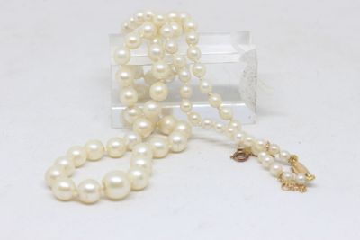 pearl necklace with a gold clasp and a white pearl bead
