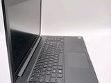 a laptop that is open on a white surface
