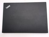 a black laptop on a white table with a white background