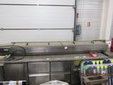an image of a commercial kitchen with stainless steel appliances