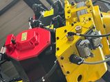 a machine that has a red and yellow engine on it