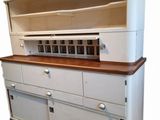 an image of a kitchen cabinet with a wooden top