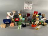 a lot of different types of perfumes on the table