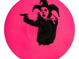 pink frisbee with a black drawing of a joker holding a gun