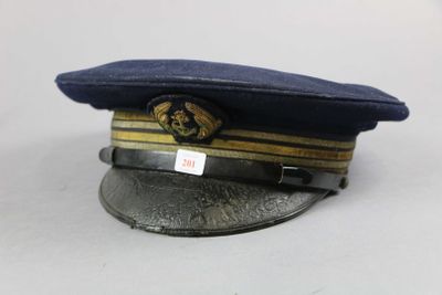 navy officer ' s hat with insignia on it on a white surface