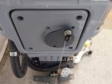 a close up of a machine with a yellow sign on it