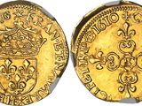 a gold coin with a crown on the front and a crown on the back