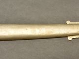 a close up of a knife with a wooden handle on a table