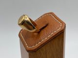wooden box with a ring on top of it on a white surface