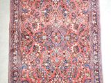 un ancien tapis persan à motif floral