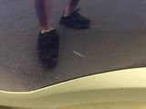 a person that is standing on a skateboard in the bathroom