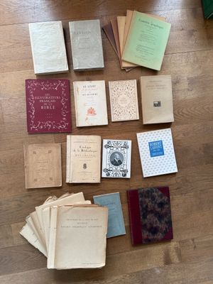 many books that are sitting on the floor together