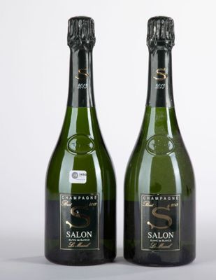 two bottles of wine sitting next to each other on top of a table