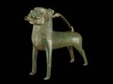 bronze statue of a dog on a black background with a black background