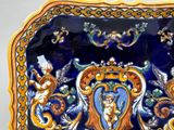 a blue and yellow plate with a picture of angels on it