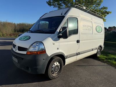 a white van that is parked on the side of the road