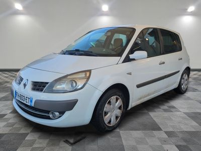 a picture of a white car parked in a garage