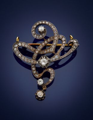 an antique diamond and gold broochle