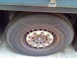 a flat tire on the back of a truck