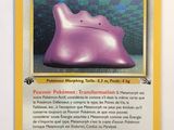 a picture of a pokemon card with a purple object