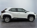 the white toyota rav is parked on the concrete floor