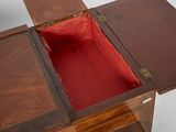 a wooden table with a red cloth inside of it