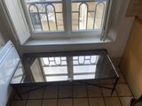 a glass table in front of a window in a room