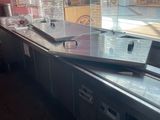 a counter that has a lot of food on it