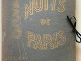 un vieux livre sur lequel sont inscrits les mots « nuts de paris »