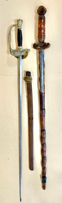 two different types of swords on a white surface