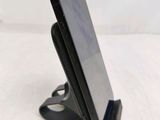 a cell phone that is sitting on a stand
