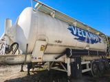 a large tanker truck that is parked on the side of the road