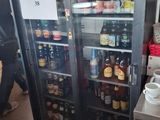 a refrigerator that has a lot of bottles of beer in it