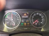 a close up of a car dashboard with various gauges