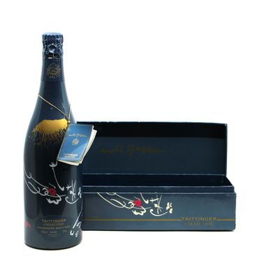 the bottle of wine is next to a box of chocolates