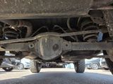 a close up of a car ' s rear end with a tire