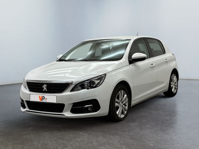 the white car is parked in a white room with a black floor