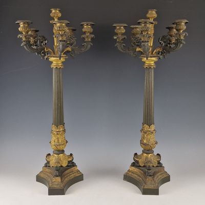 pair of antique brass candelabs with flowers and leaves