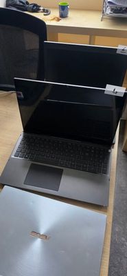 two laptops that are sitting on a table