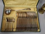 a box with a bunch of silver spoons and spoons in it